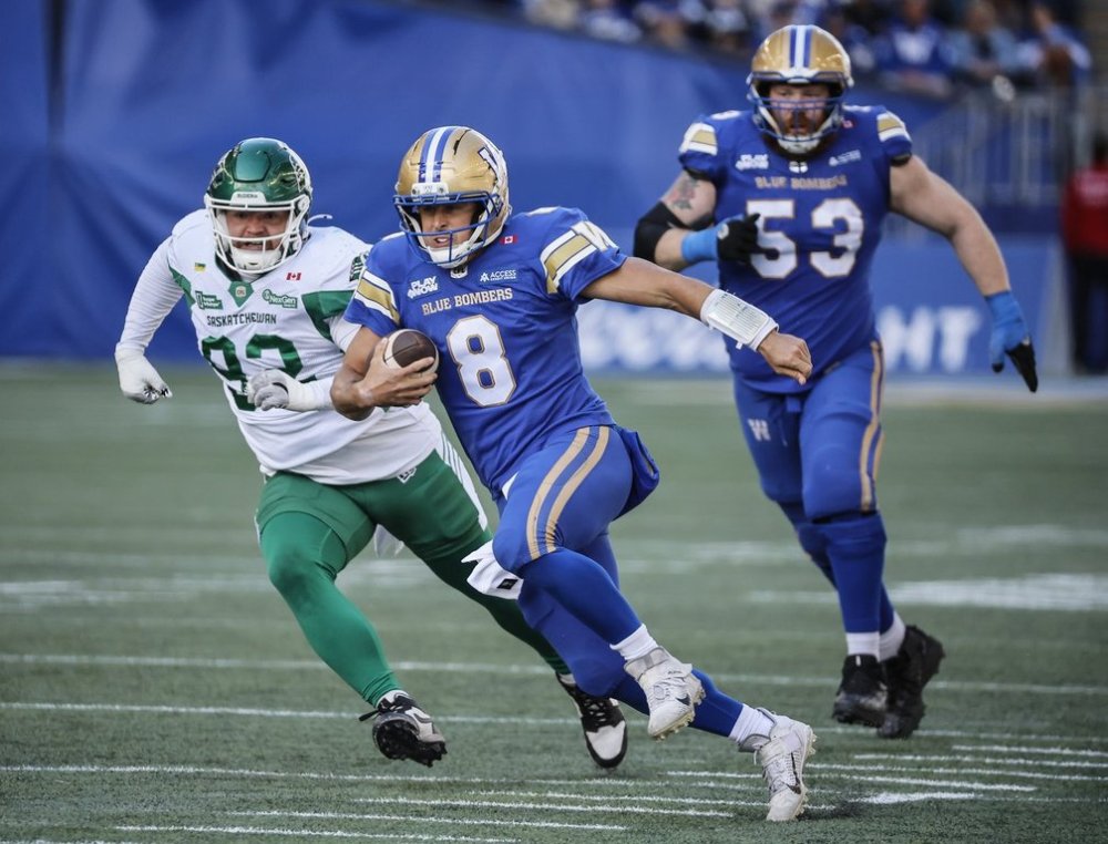 Winnipeg Blue Bombers quarterback Zach Collaros (8) runs for a first down against the Saskatchewan Roughriders during first half CFL action in Winnipeg, Saturday, Sept. 6, 2025. THE CANADIAN PRESS/John Woods