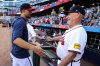 Atlanta Braves' Charlie Morton, left, offers a hug to manager Brian Snitker, right, after a baseball game against the Pittsburgh Pirates, Sunday, Sept. 28, 2025, in Atlanta. (AP Photo/Colin Hubbard)