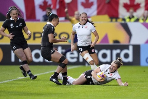 Canada's Justine Pelletier scores a try during the Women's Rugby World Cup 2025 semifinal match between Canada and New Zealand at Ashton Gate, Bristol, England, Friday Sept. 19, 2025. (Andrew Matthews/PA via AP)