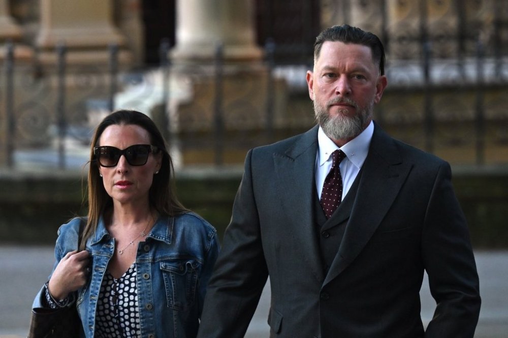 Oliver Schulz, right, arrives at the New South Wales state Supreme Court in Sydney Friday, Oct. 3, 2025, and pleaded not guilty to the war crime of murder. (Dean Lewins/AAP Image via AP)
