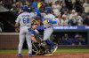 Los Angeles Dodgers' Kiké Hernandez (8) celebrates with Dalton Rushing (68) after hitting a two-run home run to score Rushing during the third inning of a baseball game against the Seattle Mariners, Friday, Sept. 26, 2025, in Seattle. (AP Photo/Ryan Sun)