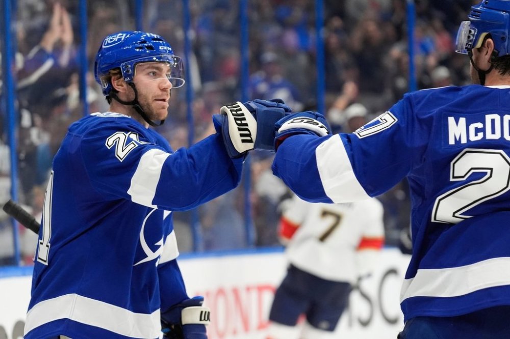 FILE - Tampa Bay Lightning center Brayden Point (21) celebrates his goal against the Florida Panthers with defenseman Ryan McDonagh (27) during the second period in Game 1 of an NHL hockey Stanley Cup first-round playoff series, Tuesday, April 22, 2025, in Tampa, Fla. (AP Photo/Chris O'Meara,File)