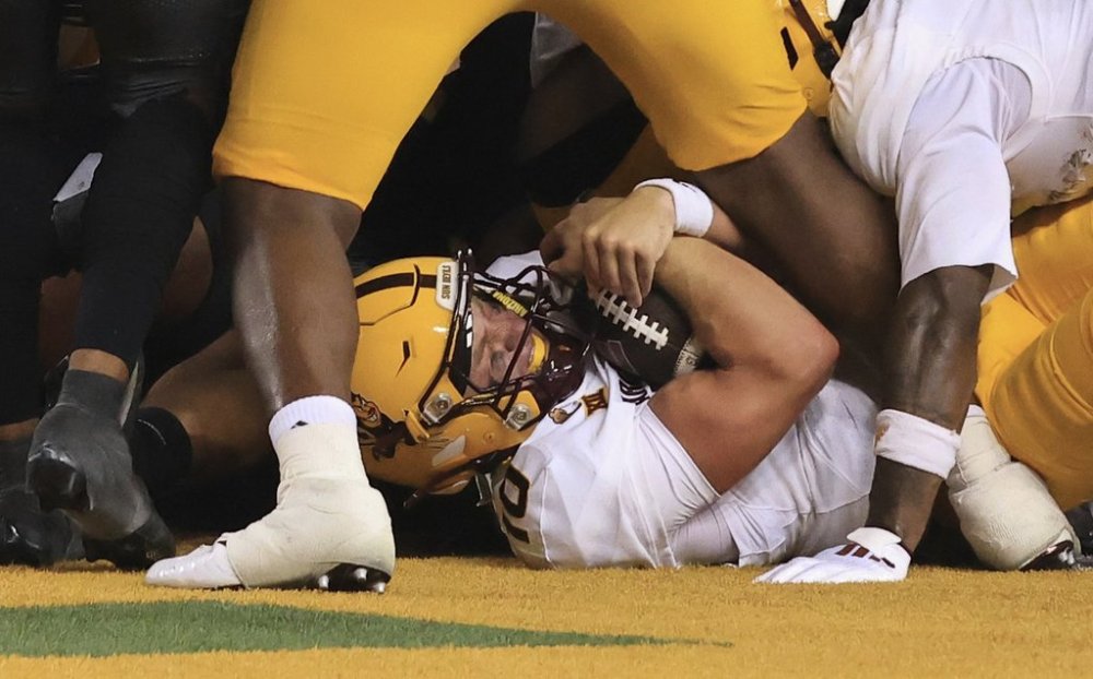 Arizona State Sam Leavitt scores a touchdown in the first half of an NCAA college football game against Baylor Saturday, Sept. 20, 2025, in Waco, Texas. (AP Photo/Jerry Larson)