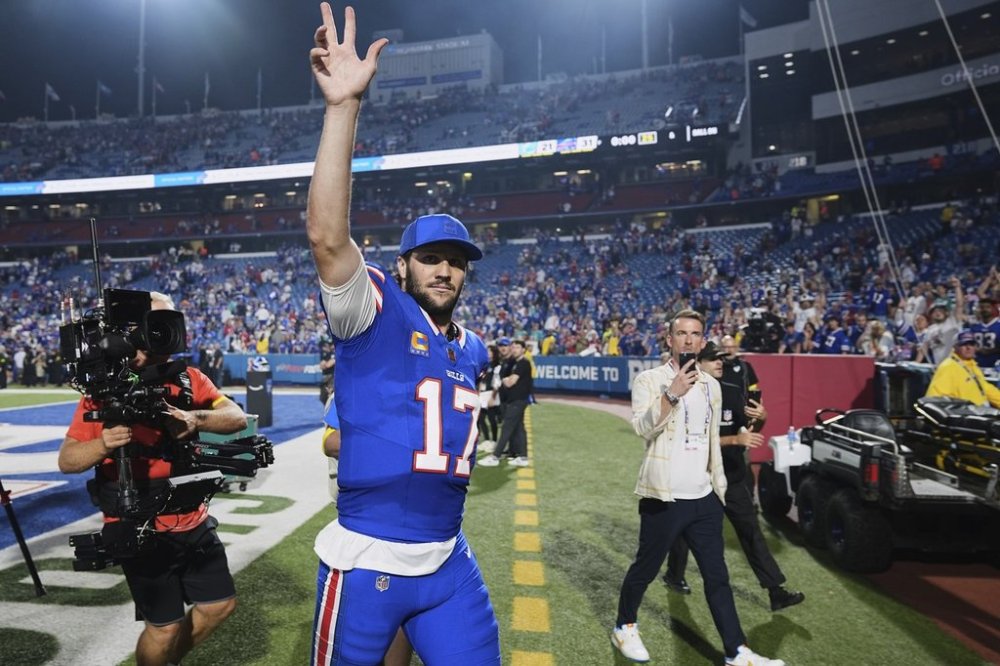 Buffalo Bills quarterback Josh Allen (17) gestures to fans as he walks off the field after the team's victory over the Miami Dolphins in an NFL football game, Thursday, Sept. 18, 2025, in Orchard Park, N.Y. (AP Photo/Matt Rourke)