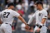 New York Yankees' Giancarlo Stanton, left, celebrates with Aaron Judge after a baseball game against the Baltimore Orioles Saturday, Sept. 27, 2025, in New York. (AP Photo/Frank Franklin II)