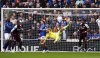 Aston Villa goalkeeper Emiliano Martinez clears under pressure from Everton's Jack Grealish during the Premier League match at the Hill Dickinson Stadium, Liverpool, England, Saturday Sept. 13, 2025. (Tim Markland/PA via AP)