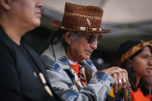 Squamish Nation Elder Sam George, a survivor of St. Paul's Residential School, listens during a gathering to mark the National Day for Truth and Reconciliation, in Vancouver, on Tuesday, Sept. 30, 2025. THE CANADIAN PRESS/Darryl Dyck