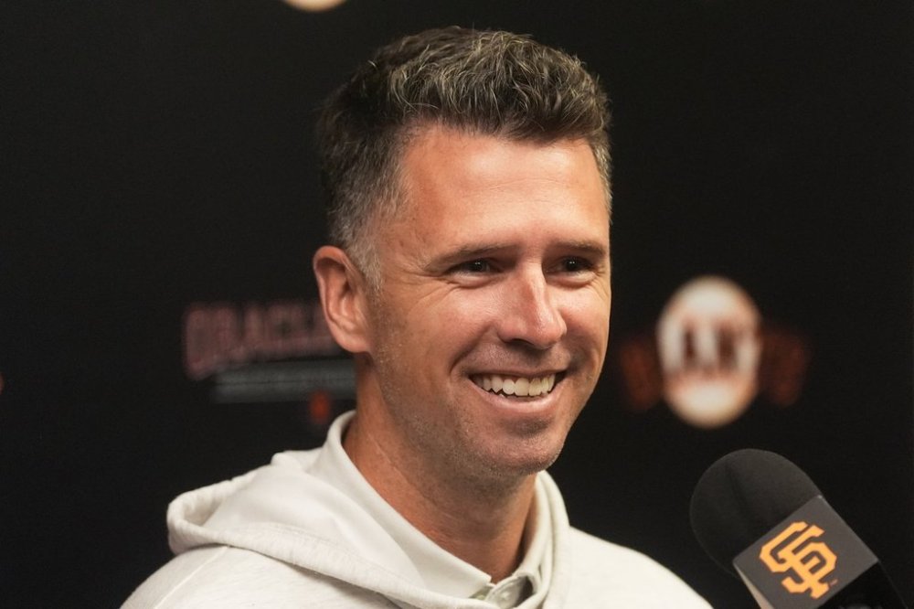 San Francisco Giants president of baseball operations Buster Posey smiles while speaking at a news conference in San Francisco, Wednesday, Oct. 1, 2025. (AP Photo/Jeff Chiu)