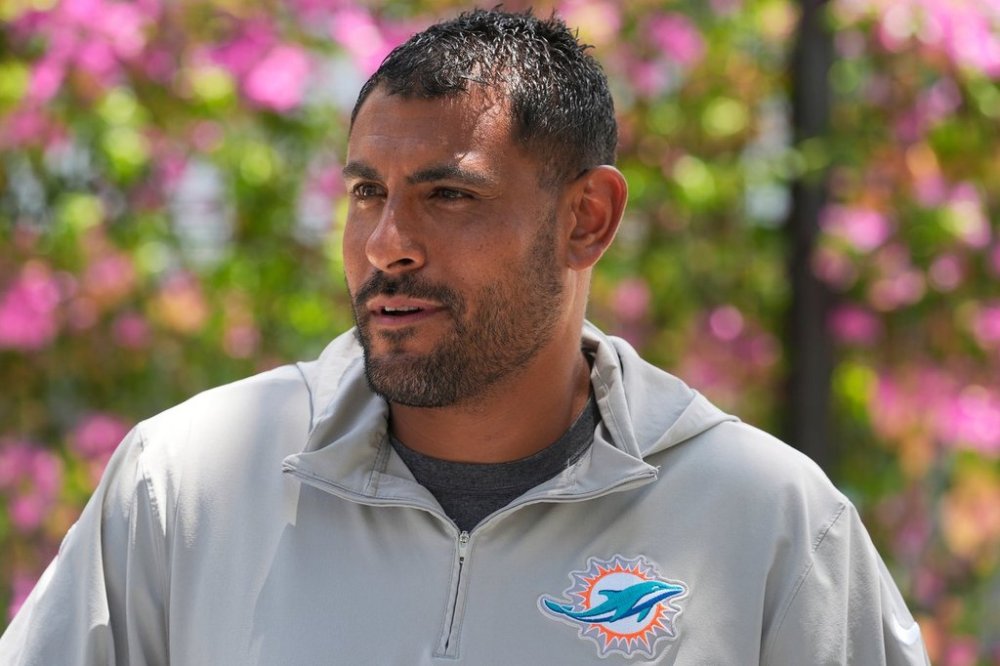 FILE - Miami Dolphins outside linebackers coach Ryan Crow speaks after NFL football practice at the team's practice facility, June 5, 2024, in Miami Gardens, Fla. (AP Photo/Marta Lavandier, File)