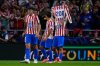 Atletico Madrid's Antoine Griezmann lifts a trikot after scoring his side's third goal during the Champions League opening phase soccer match between Atletico Madrid and Eintracht Frankfurt at the Metropolitano stadium in Madrid, Spain, Tuesday, Sept. 30, 2025. (AP Photo/Manu Fernandez)