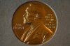 FILE - A Nobel Prize medal is displayed before a ceremony at the Swedish Ambassador's Residence in London, Monday, Dec. 6, 2021. (AP Photo/Matt Dunham, File)