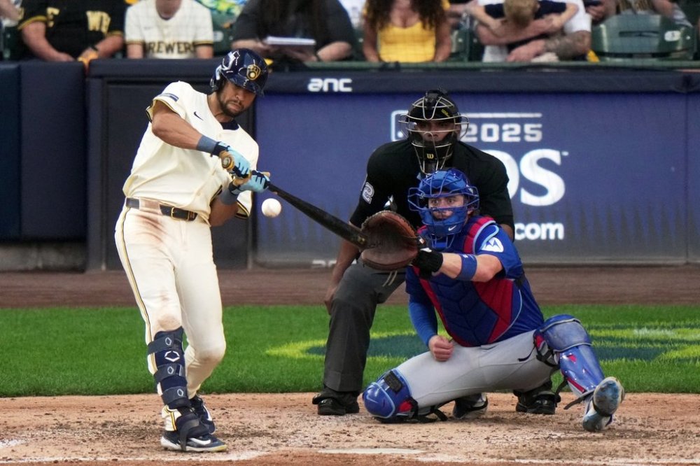 Milwaukee Brewers' Blake Perkins hits a double during the seventh inning of Game 1 of baseball's National League Division Series against the Chicago Cubs Saturday, Oct. 4, 2025, in Milwaukee. (AP Photo/Morry Gash)