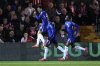 Chelsea's Facundo Buonanotte, left, celebrates scoring during the English League Cup third round soccer match between Lincoln City and Chelsea at the LNER Stadium, Lincoln, England, Tuesday Sept. 23, 2025. (Nigel French/PA via AP)
