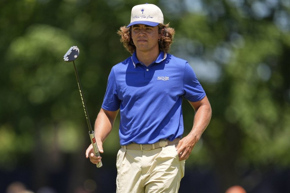 Garrick Higgo, of South Africa, waves after making a putt on the fourth hole during the third round of the PGA Championship golf tournament at the Quail Hollow Club, Saturday, May 17, 2025, in Charlotte, N.C. (AP Photo/George Walker IV)