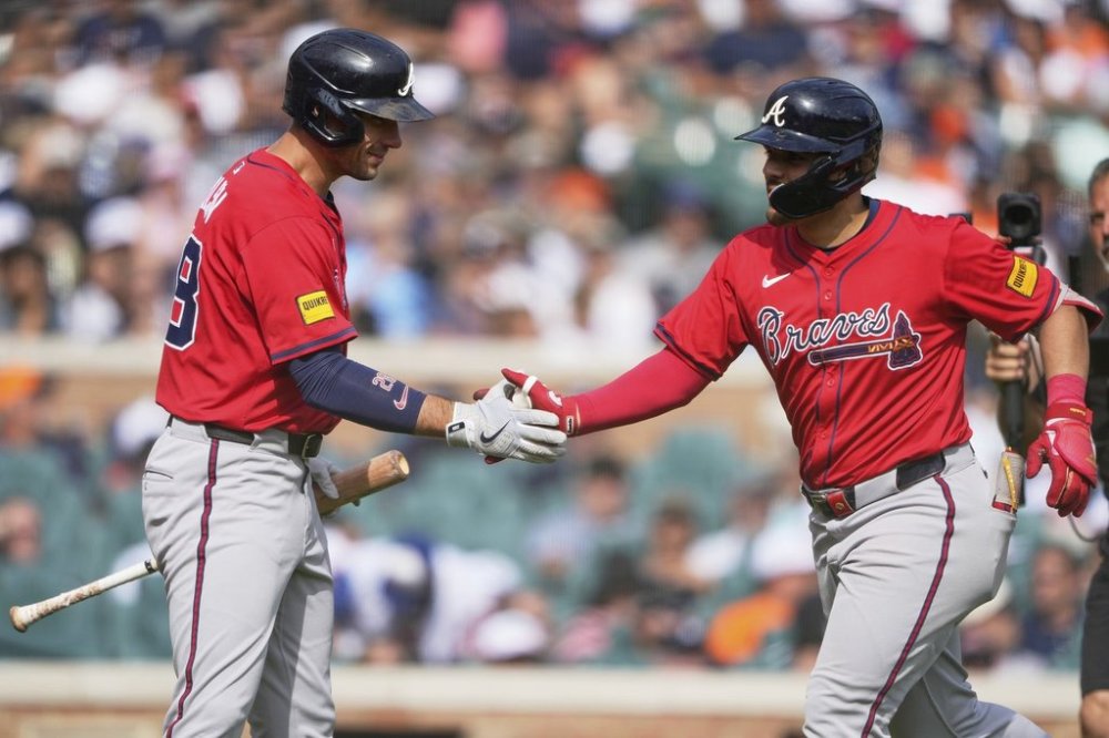 Atlanta Braves' Nacho Alvarez Jr., right, celebrates his solo home run with Matt Olson during the eighth inning of a baseball game against the Detroit Tigers, Saturday, Sept. 20, 2025, in Detroit. (AP Photo/Ryan Sun)