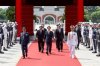 In this photo released by the Taiwan Presidential Office, Taiwan's President Lai Ching-te, center, arrives for a ceremony for honoring soldiers and officials during Taiwan's Arm Forces Day on Wednesday, Sep. 3, 2025 in Taipei, Taiwan. (Taiwan Presidential Office via AP)