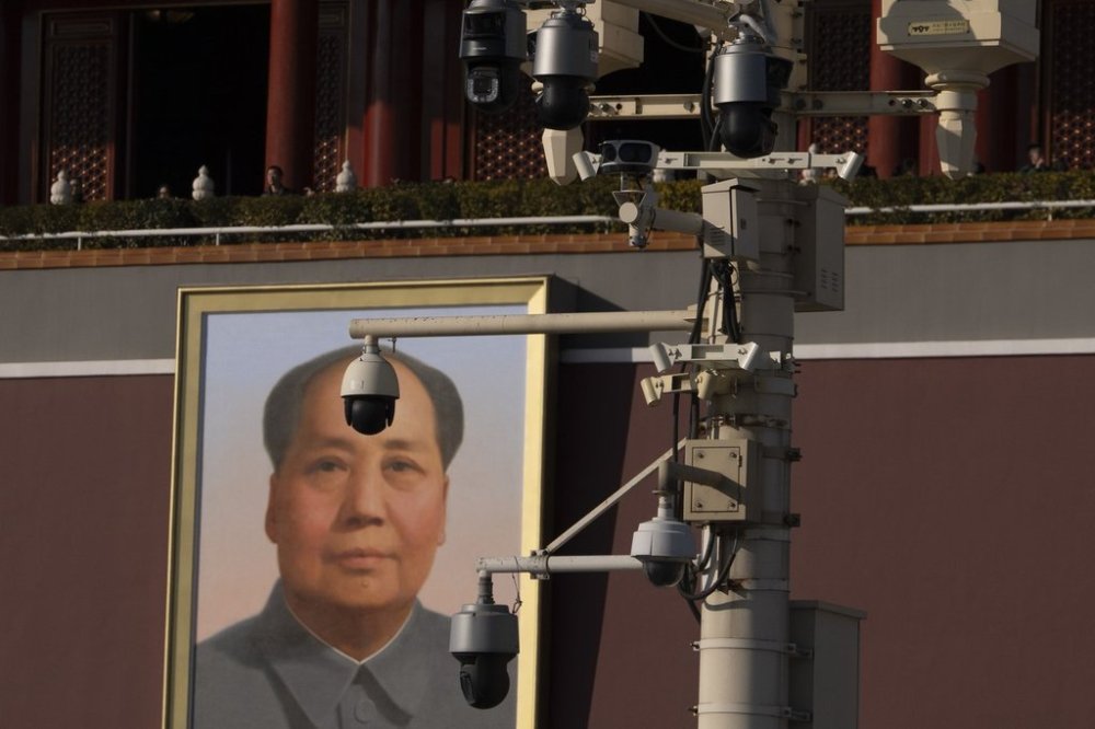 Security cameras are seen by a portrait of late Chinese leader Mao Zedong near Tiananmen Gate in Beijing, Tuesday, Feb. 18, 2025. (AP Photo/Ng Han Guan)
