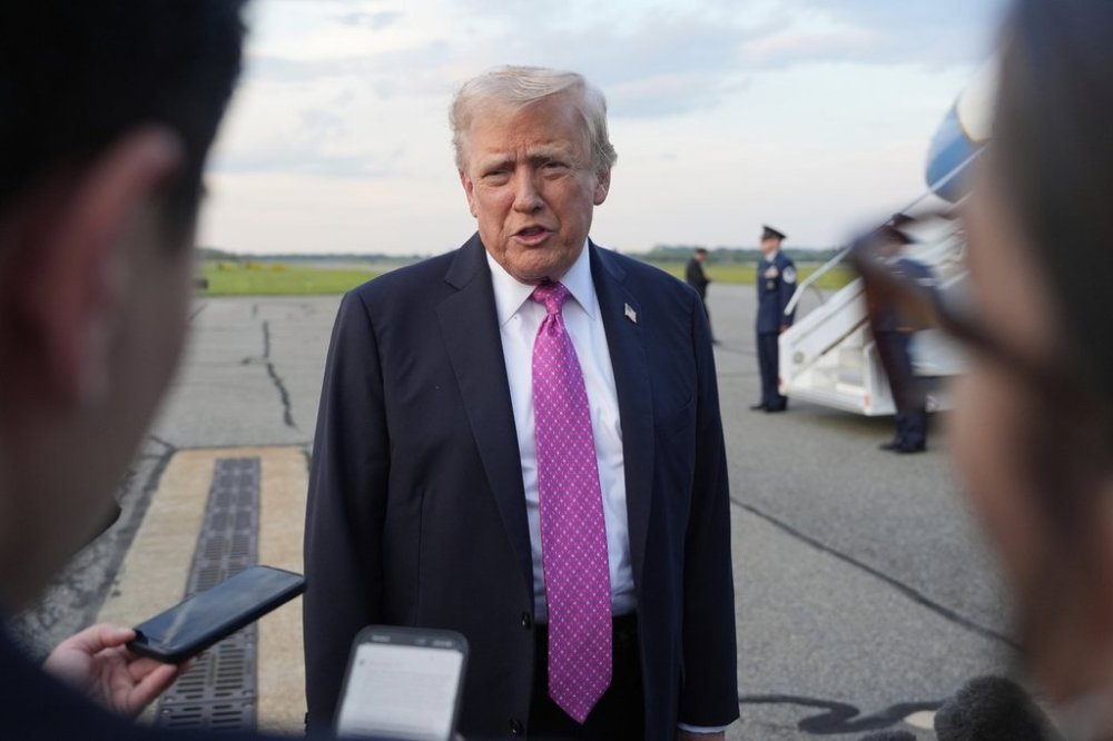President Donald Trump speaks with reporters before boarding Air Force One at Morristown Airport, Sunday, Sept. 14, 2025, in Morristown, N.J. (AP Photo/Alex Brandon)