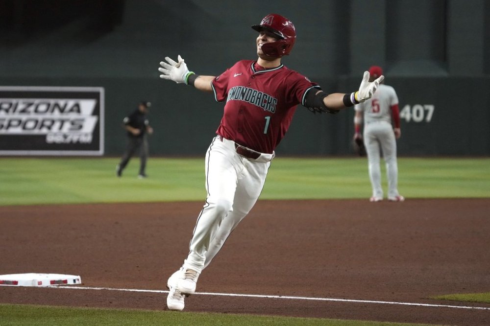 Arizona Diamondbacks' Jorge Barrosa (1) reacts after hitting a solo home run against the Philadelphia Phillies in the sixth inning of a baseball game, Sunday, Sept. 21, 2025, in Phoenix. (AP Photo/Rick Scuteri)