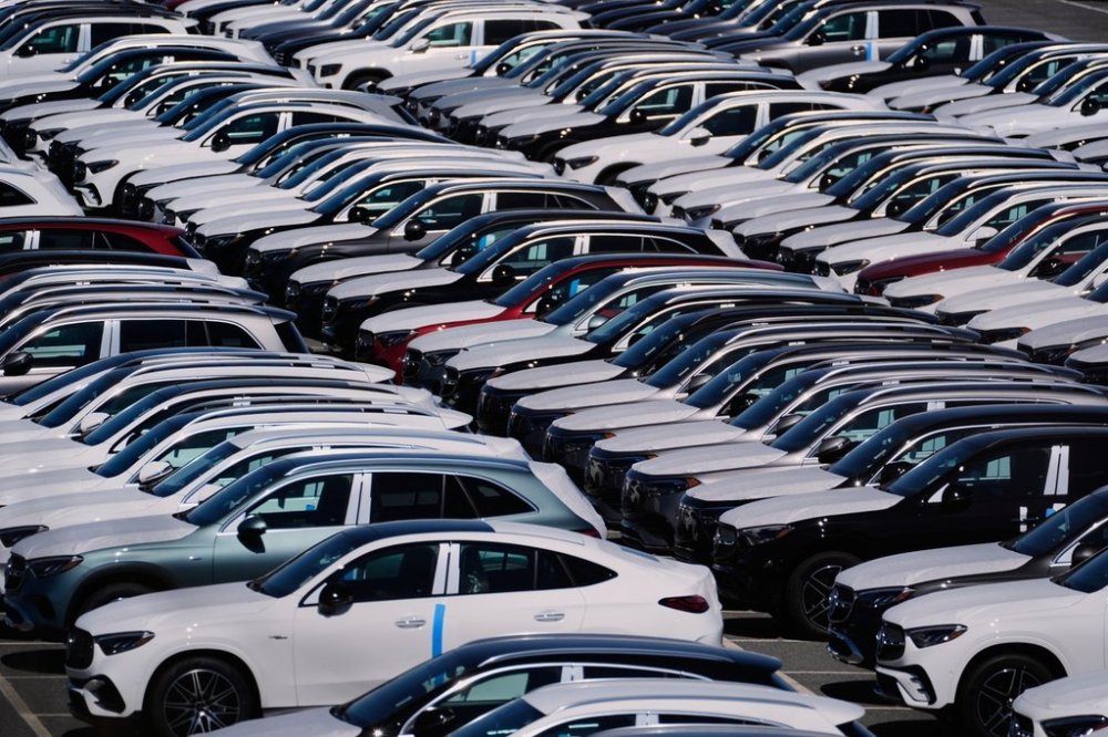 Canadian car and auto part exports faced more than US$380 million in tariff duties in July, marking a sharp jump from previous months as U.S. tariffs kicked in. Vehicles are seen at the Mercedes-Benz Vehicle Preparation Center at the Port of Baltimore, where new Mercedes-Benz vehicle imports are processed before distribution to dealerships, Thursday, March 27, 2025, in Baltimore. (AP Photo/Stephanie Scarbrough)