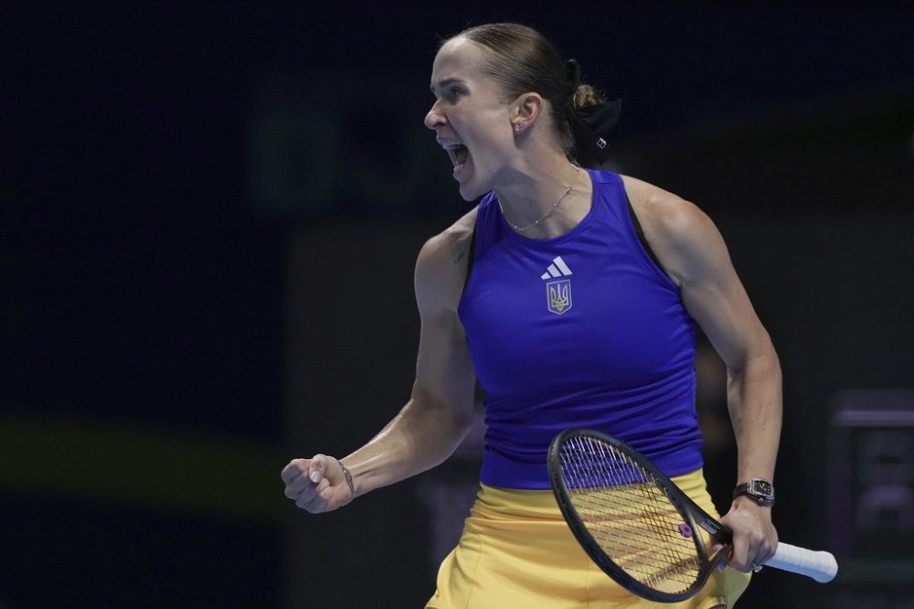 Elina Svitolina, of Ukraine reacts during the Billie Jean King Cup semifinals tennis match against Jasmine Paolini, of Italy, at the Shenzhen Bay Sports Center Arena, in Shenzhen, China's Guangdong province, Friday, Sept. 19, 2025. (AP Photo/Andy Wong)