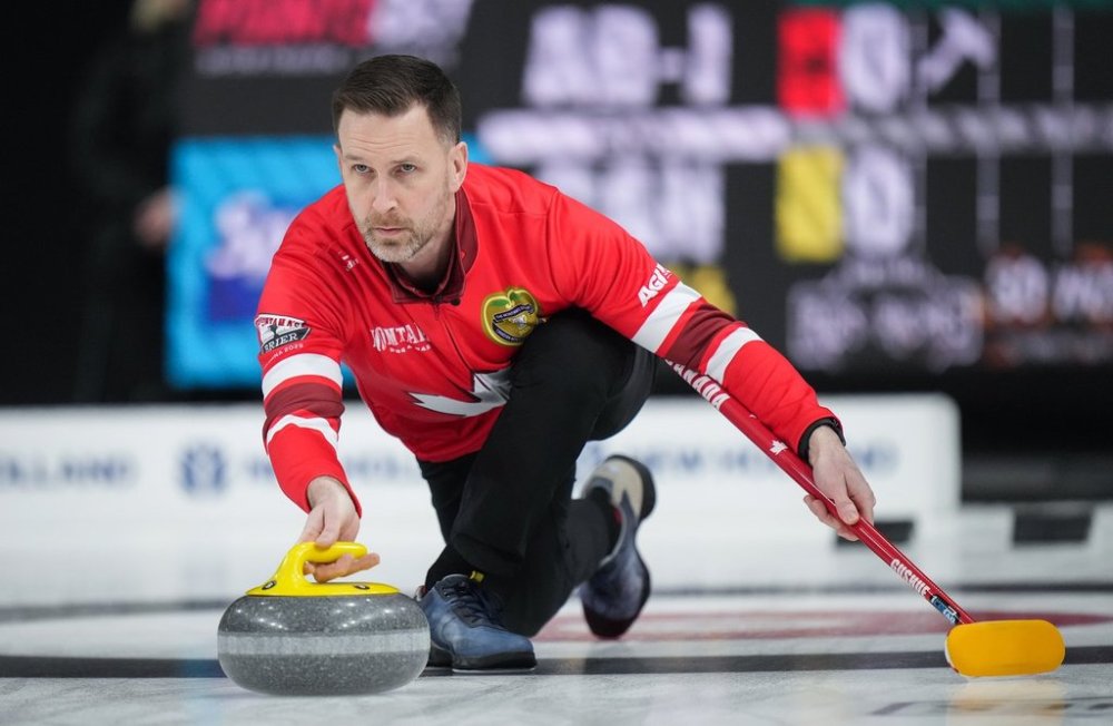 Canada skip Brad Gushue delivers a rock while playing Alberta-Jacobs during the semifinal at the Brier, in Kelowna, B.C., on Sunday, March 9, 2025. THE CANADIAN PRESS/Darryl Dyck