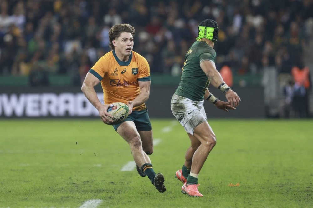 Australia's James O'Connor, left, is challenged by South Africa's Cheslin Kolbe during a rugby championship test match between South Africa and Australia, at Cape Town stadium in Cape Town, South Africa, Saturday, Aug. 23, 2025. (AP Photo/Halden Krog)