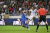 Italy's Mateo Retegui kicks the ball ahead of Israel's Raz Shlomo during a Group I, World Cup qualifier soccer match between Israel and Italy at the Nagyerdei Stadium in Debrecen, Hungary, Monday, Sept. 8, 2025. (AP Photo/Denes Erdos)