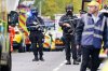Armed police officers at the scene of a stabbing incident at Heaton Park Hebrew Congregation synagogue, in Crumpsall, Manchester, England, Thursday Oct. 2, 2025. (Peter Byrne/PA via AP)