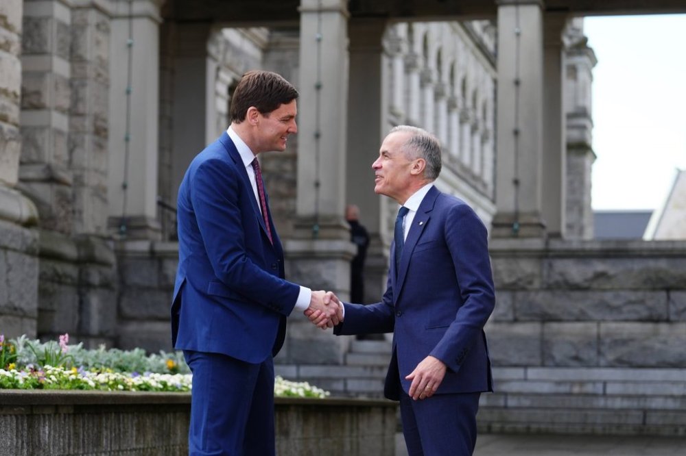 Prime Minister Mark Carney, right, meets with British Columbia Premier David Eby at the Legislative Assembly of British Columbia in Victoria on Monday, April 7, 2025. THE CANADIAN PRESS/Sean Kilpatrick