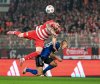 Berlin's Oliver Burke, left, and Hamburger's Miro Muheim in action during the Bundesliga soccer match between FC Union Berlin and Hamburger SV in Berlin, Sunday Sept. 28, 2025. (Soeren Stache/dpa via AP)