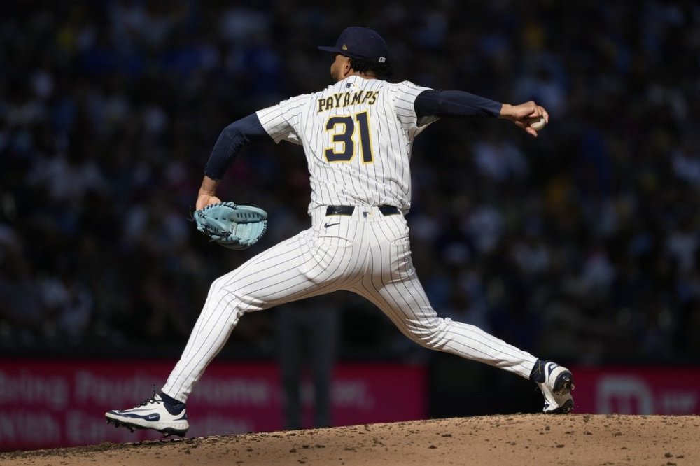 Milwaukee Brewers' Joel Payamps pitches during the ninth inning of a baseball game against the St. Louis Cardinals, Sunday, Sept. 14, 2025, in Milwaukee. (AP Photo/Aaron Gash)