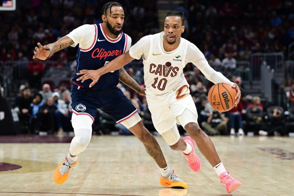 FILE-Cleveland Cavaliers guard Darius Garland drives on Los Angeles Clippers forward Derrick Jones Jr. in the second half of an NBA basketball game Sunday, March 30, 2025, in Cleveland. (AP Photo/David Dermer, FILE )