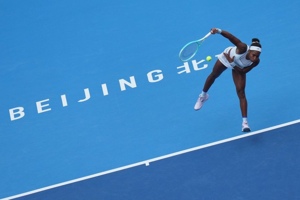 Coco Gauff, of the United States serves against Eva Lys, of Germany during the women's singles quarterfinals match of the China Open tennis tournament, at the National Tennis Center, in Beijing, Thursday, Oct. 2, 2025. (AP Photo/Andy Wong)