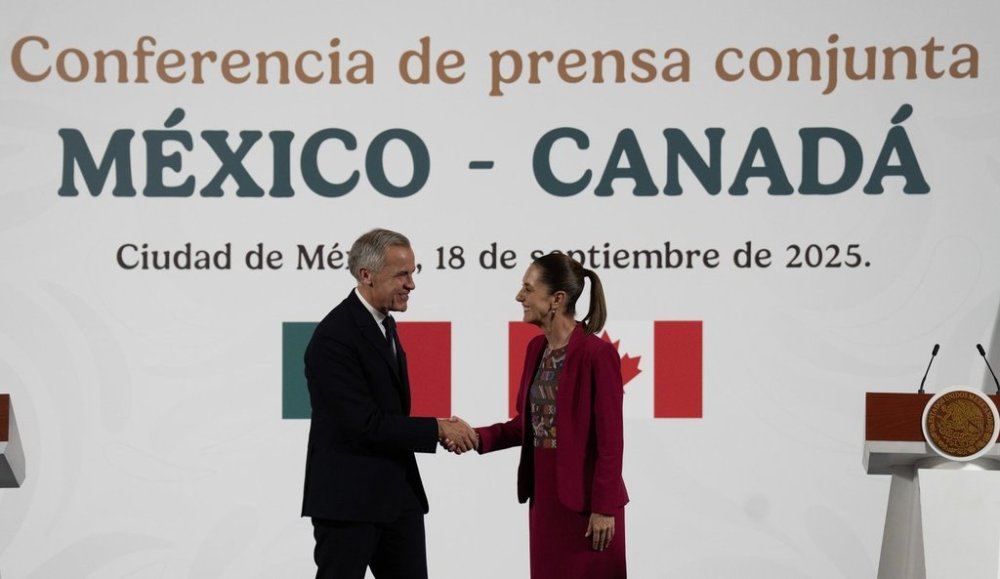 Prime Minister Mark Carney shakes hands with Mexican President Claudia Sheinbaum following a joint news conference at the National Palace in Mexico City, Thursday, Sep 18, 2025. THE CANADIAN PRESS/Adrian Wyld