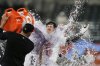 Baltimore Orioles' Dylan Beavers (12) is doused after hitting a walk-off single during the 10th inning of a baseball game against the Pittsburgh Pirates, Wednesday, Sept. 10, 2025, in Baltimore. (AP Photo/Stephanie Scarbrough)