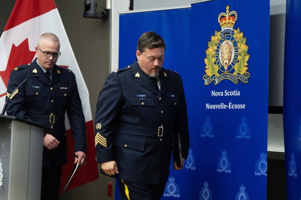 S/Sgt. Rob McCamon, centre, officer in charge of Major Crime and Behavioural Sciences with the Nova Scotia RCMP, leaves a press conference where he announced 66 charges of historical sexual abuses that occurred at the Nova Scotia Youth Centre between 1989 and 2015 during a press conference in Halifax on Wednesday, Sept. 17, 2025. THE CANADIAN PRESS/Darren Calabrese