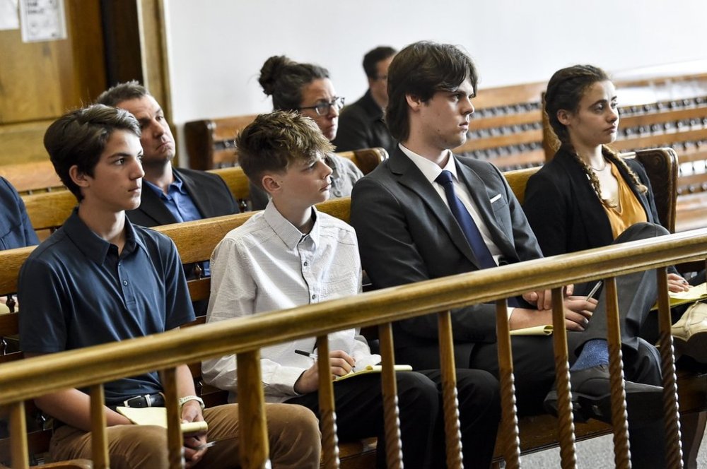 FILE - Plaintiffs in a climate lawsuit brought by children and young adults in Montana listen to arguments during a May 12, 2023, court hearing in Helena, Mont. (Thom Bridge/Independent Record via AP, file)/