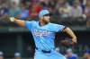 Texas Rangers starting pitcher Merrill Kelly throws a pitch during the first inning of a baseball game against the Miami Marlins on Sunday, Sept. 21, 2025, in Arlington, Texas. (AP Photo/Ronaldo Bolaños)