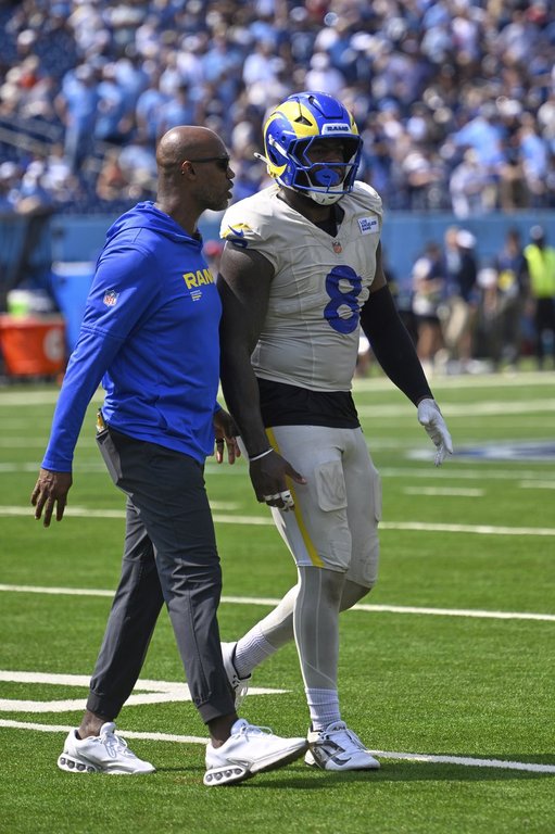 Los Angeles Rams linebacker Jared Verse is assisted off the field after being injured during the first half of an NFL football game against the Tennessee Titans, Sunday, Sept. 14, 2025, in Nashville, Tenn. (AP Photo/John Amis)