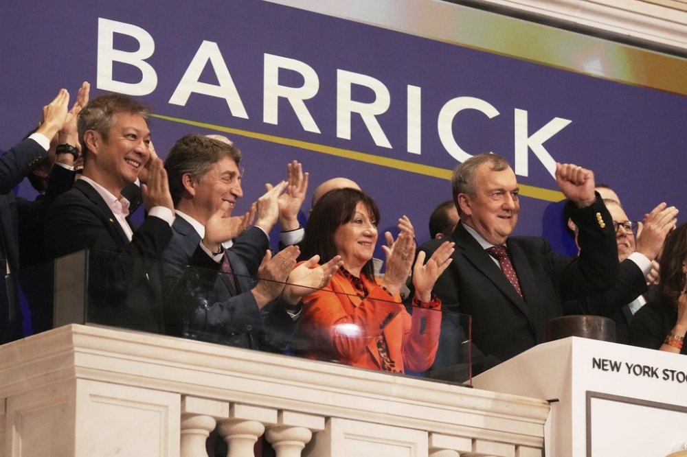Barrick Mining Corporation President & CEO Mark Bristow, right, rings the New York Stock Exchange opening bell, Friday, May 9, 2025. Barrick has agreed to sell its Hemlo gold mine to Carcetti Capital Corp. for proceeds of up to $1.09 billion. (AP Photo/Richard Drew)