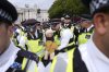 Police remove a protester taking part in a demonstration organised by Defend our Juries, in support of Palestine Action in Trafalgar Square, London Saturday Oct. 4, 2025. (Maja Smiejkowska/PA via AP)
