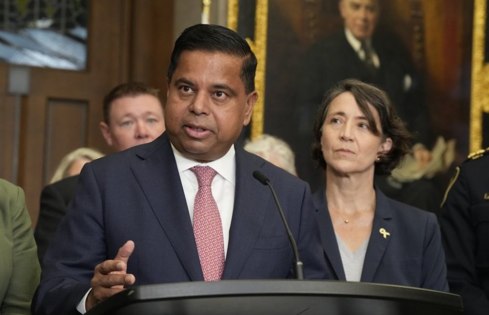 MP for Châteauguay-Les Jardins-de-Napierville Nathalie Provost looks on as Minister of Public Safety Gary Anandasangaree speaks in the foyer of the House of Commons on Parliament Hill in Ottawa on Tuesday, Sept. 23, 2025. THE CANADIAN PRESS/Adrian Wyld
