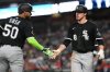 Chicago White Sox' Kyle Teel, right, is greeted by Lenyn Sosa after he scored on a double by Brooks Baldwin during the first inning of a baseball game against the Washington Nationals, Friday, Sept. 26, 2025, in Washington. (AP Photo/Nick Wass)