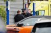 A police officer speaks to a member of the public at the scene of a stabbing at Heaton Park Hebrew Congregation synagogue, in Crumpsall, Manchester, England, Thursday Oct. 2, 2025. (Peter Byrne/PA via AP)