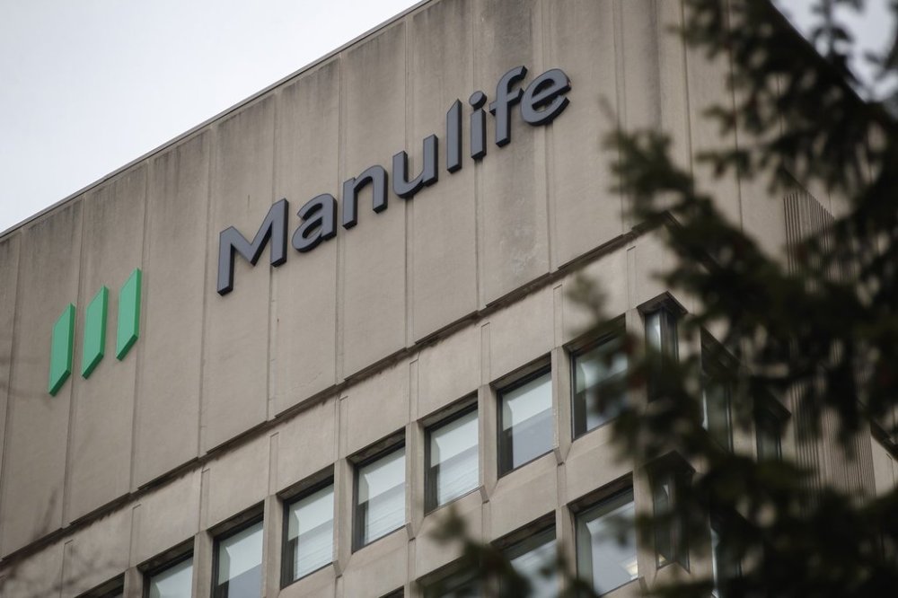 Signage is seen on Manulife Financial Corp.'s office tower in Toronto, Tuesday, Feb. 11, 2020. THE CANADIAN PRESS/Cole Burston