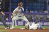 Philadelphia Phillies short stop Trea Turner is late with the tag as Miami Marlins' Troy Johnston steals second base during the sixth inning of a baseball game Sunday, Sept. 7, 2025, in Miami. (AP Photo/Marta Lavandier)