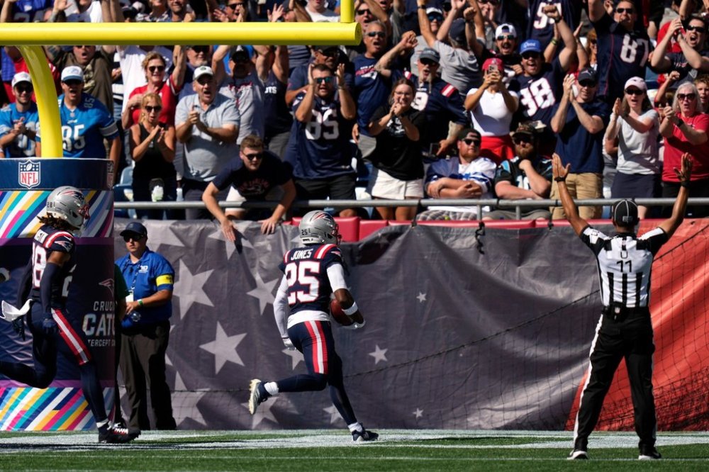 New England Patriots cornerback Marcus Jones (25) returns a punt for a touchdown against the Carolina Panthers during the first half of an NFL football game, Sunday, Sept. 28, 2025, in Foxborough, Mass. (AP Photo/Charles Krupa)