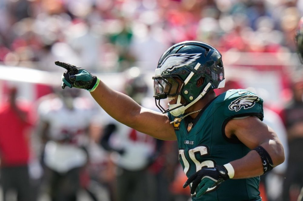 Philadelphia Eagles running back Saquon Barkley (26) celebrates after scoring a touchdown during the second half of an NFL football game against the Tampa Bay Buccaneers, Sunday, Sept. 28, 2025, in Tampa, Fla. (AP Photo/Chris O'Meara)