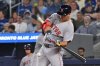 Boston Red Sox's Nathaniel Lowe (37) hits an RBI single against the Toronto Blue Jays in second inning American League baseball action in Toronto on Tuesday, Sept. 23, 2025. THE CANADIAN PRESS/Jon Blacker